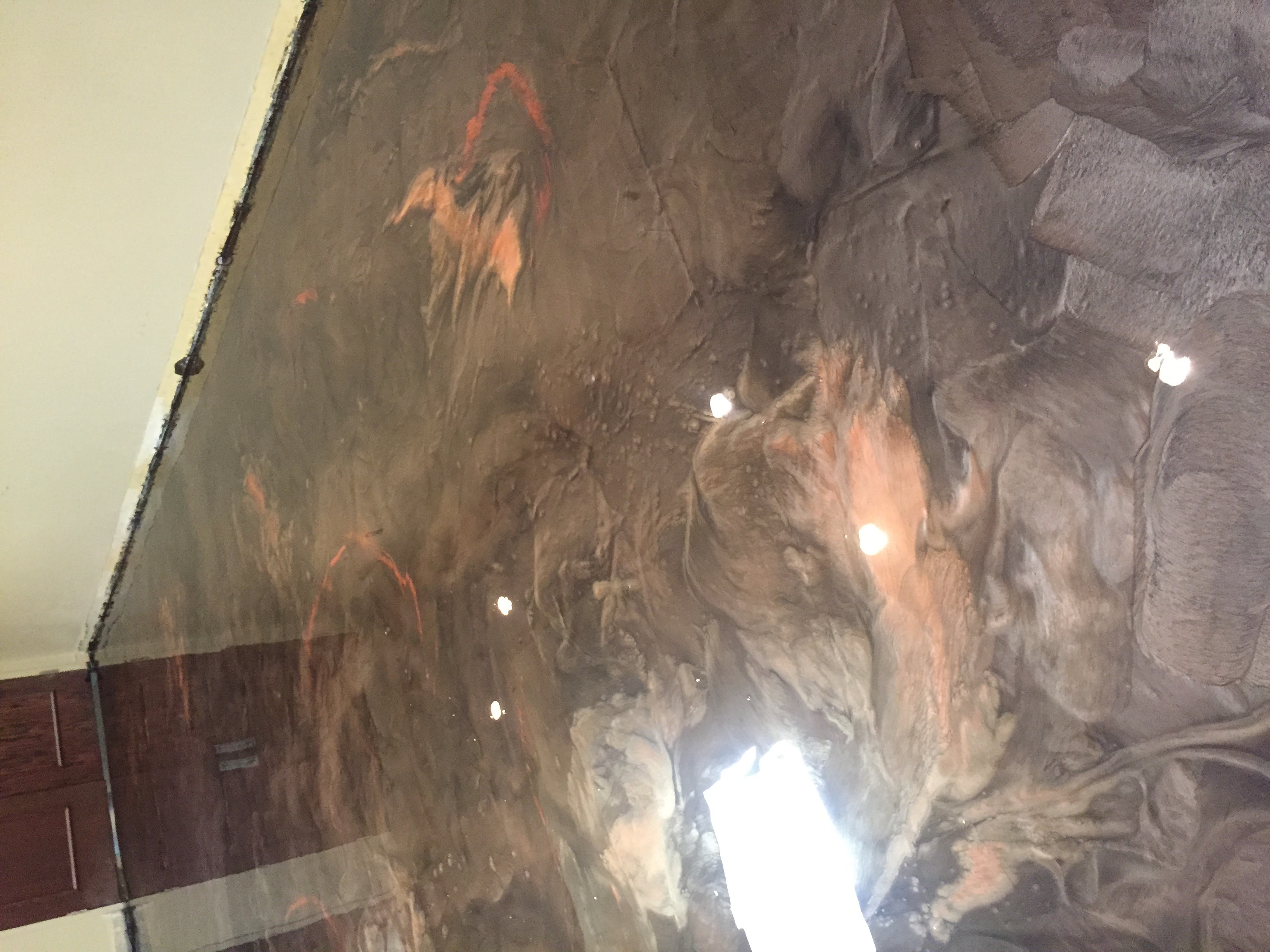 Dark copper metallic epoxy floor with swirl pattern Hinesville GA